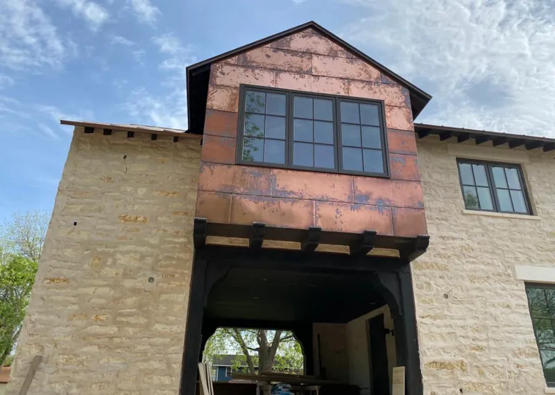 Copper metal panel facade on a stone building for Skylight Installation in North Potomac